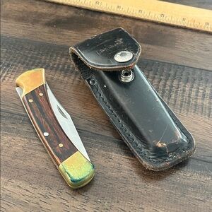 Vintage buck 110 folding knife with sheath